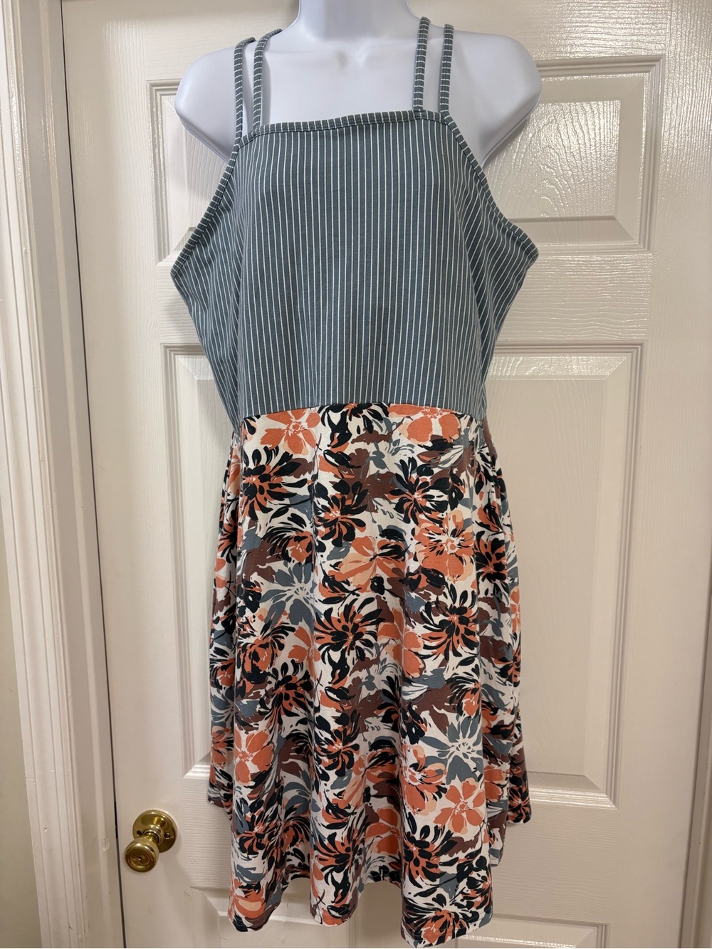 Pact organic cotton sundress with a striped bodice and a floral print skirt.